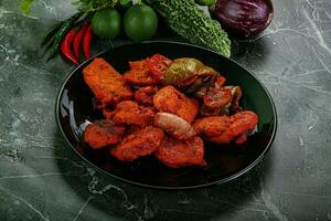 Indian cuisine - chicken tikka barbecue photo