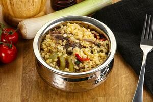 Bulgur with lamb and vegetables photo