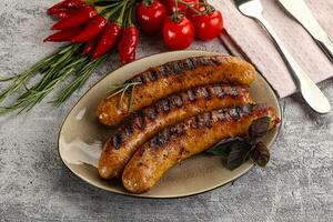 Grilled meat sausages with spices photo