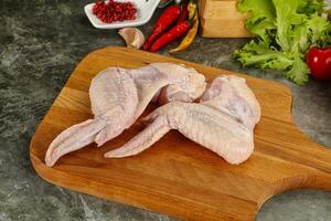 Raw chicken wings foe cooking photo