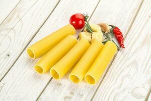 Raw uncooked Italian pasta Cannelloni photo