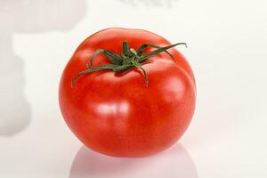 Ripe tasty and juicy tomato isolated photo