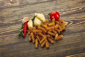 Raw whole grain pasta fusilli photo