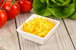 Shredded cheese in the bowl photo