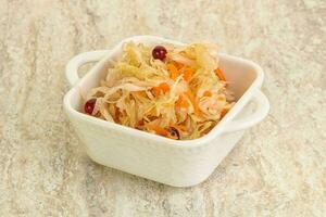 Fermented cabbage - sauerkraut in the bowl photo