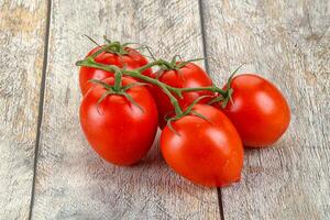 Raw red Flamenco tomato branch photo