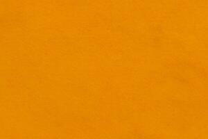 Bright orange textured felt fabric material background photo