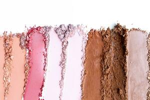Samples of cosmetic powder on white background photo