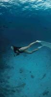 Woman freediver in a clear tropical water with nurse sharks in Maldives. Vertical footage video