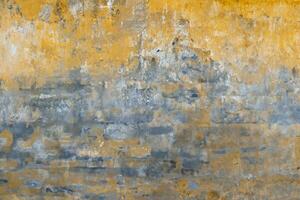 Background of old yellow painted wall texture photo