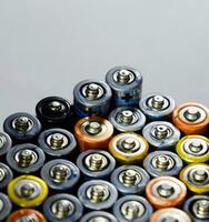 Salt and alkaline batteries, source of energy for portable technology. AAA and AA batteries photo