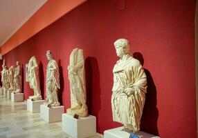 Marble statues of gods and emperors of antiquity in the Museum of Antiquities of Antalya, Turkey. photo