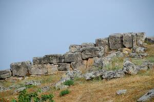 Limestone blocks an earthquake-destroyed wall of city of Hierapolis. photo