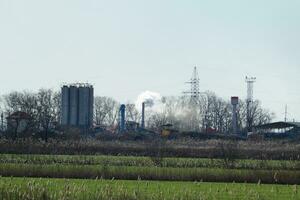 The smoke from the chimney of  plant photo