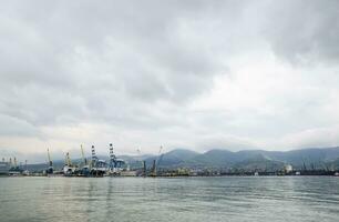 The international sea port of Novorossiysk. Port cranes and industrial objects. Marine Station. photo