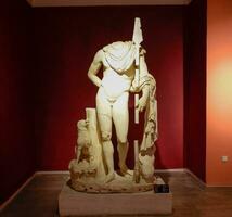 Marble statues of gods and emperors of antiquity in the Museum of Antiquities of Antalya, Turkey. photo