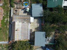 Private house and outbuildings. Repair the roof of the house photo