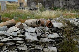 remains of ancient ceramic pipes from the water supply. Prefabricated sections of ceramics from which the pipeline was assembled. photo