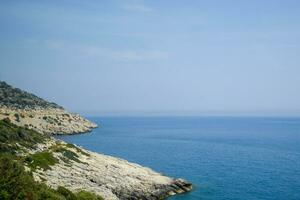 coast of the Mediterranean Sea. The shore is composed of limestone and marble. photo