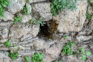 Hole in the wall of limestone photo