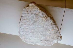 A piece of plate with inscriptions in Latin or ancient Roman. Antalya Antiquity Museum photo