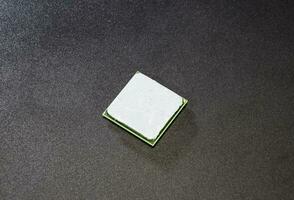 The processor of the computer with the thermal paste applied on it. Details of the computer's system unit. photo