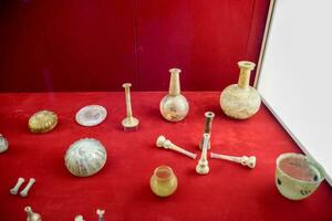 Glassware in the Antalya Museum. Ancient flasks and beakers. photo