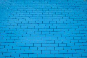 blue bottom of the pool. Pool water top view, rectangular pool tile photo