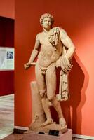 Marble statues of gods and emperors of antiquity in the Museum of Antiquities of Antalya, Turkey. photo