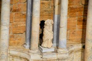 Marble statues at the columns of the amphitheater in Hierapolis, Turkey. photo