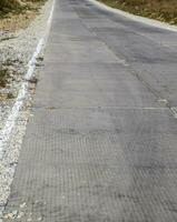 Road from concrete slabs. Reinforced concrete slabs on the road. Road surface for industrial transport photo