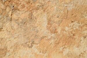Texture of processed ancient marble block. Traces of ancient tools photo