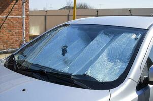 Sun Reflector windscreen. Protection of the car panel from direct sunlight photo