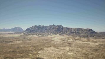 A mountain range in the middle of a desert video