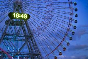 A dusk ferris wheel in Yokohama telephoto shot photo