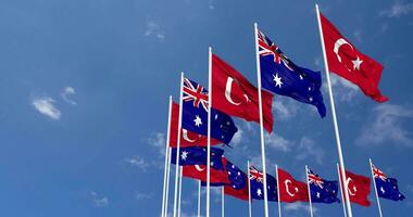 Australia and Turkey Flags Waving Together in the Sky, Seamless Loop in Wind, Space on Left Side for Design or Information, 3D Rendering video