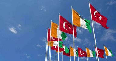 Ivory Coast and Turkey Flags Waving Together in the Sky, Seamless Loop in Wind, Space on Left Side for Design or Information, 3D Rendering video