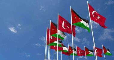 Jordan and Turkey Flags Waving Together in the Sky, Seamless Loop in Wind, Space on Left Side for Design or Information, 3D Rendering video