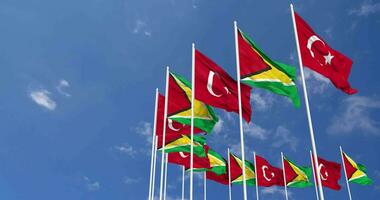 Guyana and Turkey Flags Waving Together in the Sky, Seamless Loop in Wind, Space on Left Side for Design or Information, 3D Rendering video