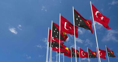 Papua New Guinea and Turkey Flags Waving Together in the Sky, Seamless Loop in Wind, Space on Left Side for Design or Information, 3D Rendering video