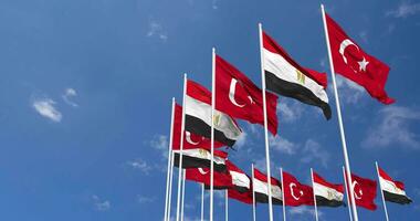 Egypt and Turkey Flags Waving Together in the Sky, Seamless Loop in Wind, Space on Left Side for Design or Information, 3D Rendering video