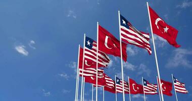 Liberia and Turkey Flags Waving Together in the Sky, Seamless Loop in Wind, Space on Left Side for Design or Information, 3D Rendering video