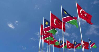 Namibia and Turkey Flags Waving Together in the Sky, Seamless Loop in Wind, Space on Left Side for Design or Information, 3D Rendering video