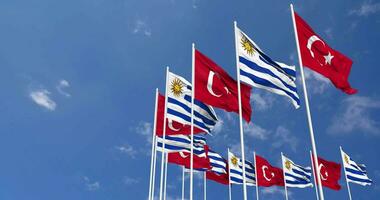 Uruguay and Turkey Flags Waving Together in the Sky, Seamless Loop in Wind, Space on Left Side for Design or Information, 3D Rendering video