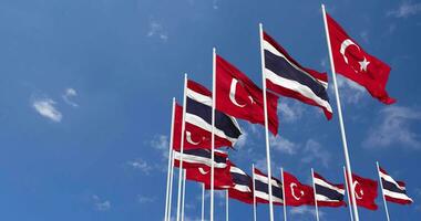 Thailand and Turkey Flags Waving Together in the Sky, Seamless Loop in Wind, Space on Left Side for Design or Information, 3D Rendering video