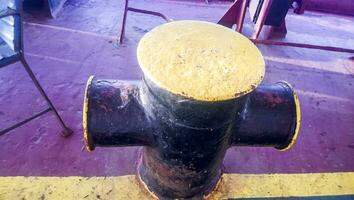 Mooring bollard on the decks of an industrial seaport. photo