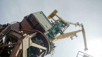 View from the top to the top of the port tower crane. Industrial photo