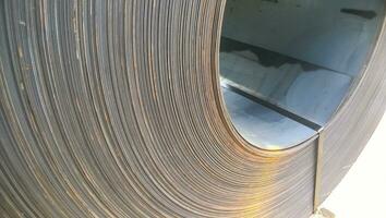 Steel sheets rolled up into rolls. Export Steel. Packing of stee photo