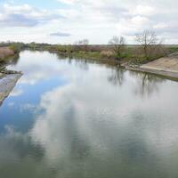 Paved concrete banks of the irrigation canal at the outlet of th photo