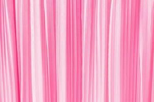 delicate chic textile background of pink color. pleats of chiffon or silk fabric. Abstract background for design. A copy space photo